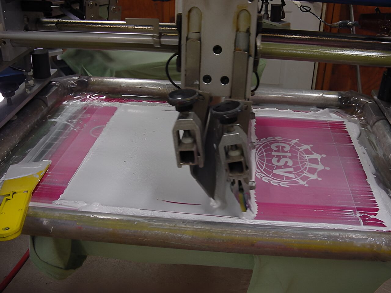 Screen printing machine creating a design.