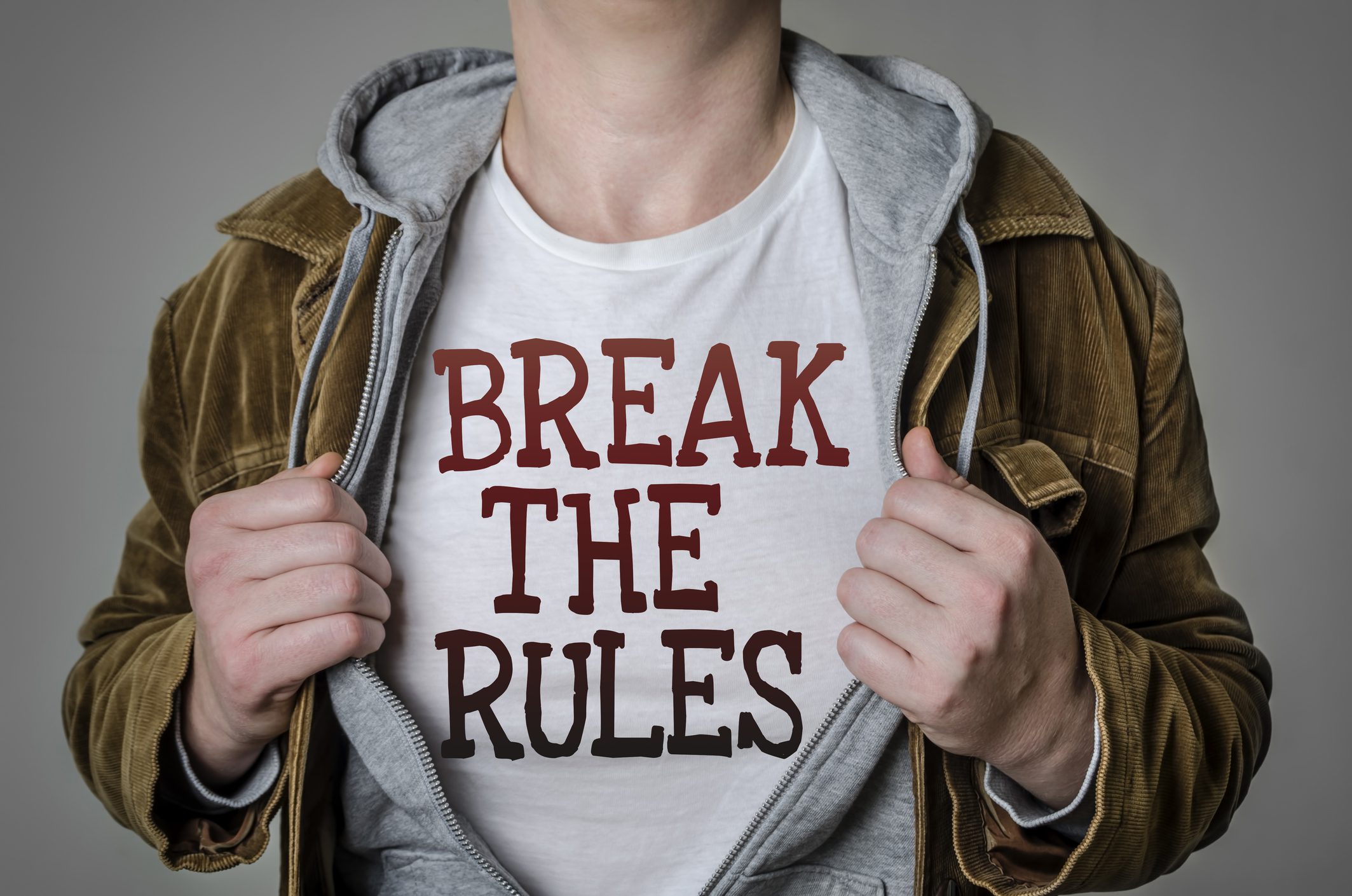 Person showing "Break the Rules" shirt.