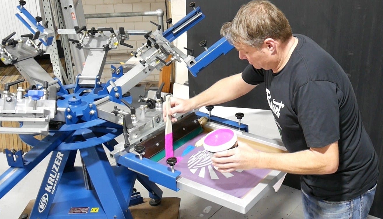 68234a716f620_guy putting ink in screen (1)